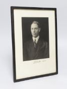 A vintage black and white framed photograph of King George VI, signed and dated Albert 1922,