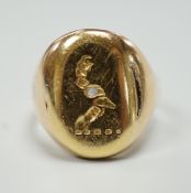 A yellow metal signet ring, carved with a crest, size K, 5.2 grams.