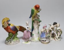 An 18th century Meissen figure group, 16cm, two 19th century Meissen figures, German cockatoo, and a