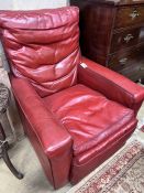 A contemporary red leather armchair, width 85cm, depth 100cm, height 100cm