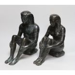 A pair of cast bronze seated Egyptian figures wearing headdresses, the largest 30cm high