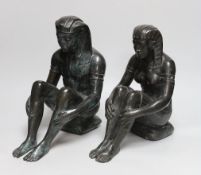 A pair of cast bronze seated Egyptian figures wearing headdresses, the largest 30cm high