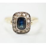 A mid 20th century yellow metal, sapphire and diamond set rectangular cluster ring, size W/X,