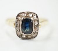 A mid 20th century yellow metal, sapphire and diamond set rectangular cluster ring, size W/X,