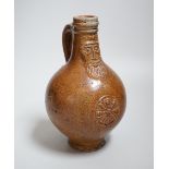 A 17th century stoneware Bellarmine or Bartmann jug, 21cm