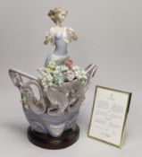 A Lladro porcelain table centrepiece, ‘’Love’s first light’’, number 01862, sculpture Joan