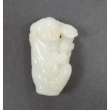 A Chinese white jade boy with ruyi sceptre, 7cm