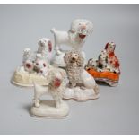 Five Victorian Staffordshire dog groups, the largest 12cm high
