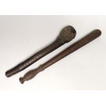 A truncheon with turned handle and a hardwood knobkerrie, the largest 47cm in length