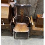 A 19th century Windsor elm and fruit wood comb back armchair with pierced central splat, width 51cm,