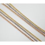 A modern three colour 9ct gold triple strand chain necklace, 46cm, 4.9 grams.