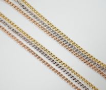 A modern three colour 9ct gold triple strand chain necklace, 46cm, 4.9 grams.