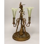 A gilt-metal three-branch epergne with seated dog and three opalescent green glass flutes, 41cm