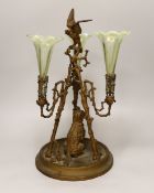 A gilt-metal three-branch epergne with seated dog and three opalescent green glass flutes, 41cm
