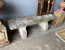 A rectangular reconstituted stone garden bench, length 144cm, width 38cm, height 47cm