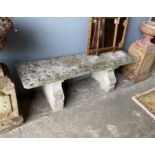 A rectangular reconstituted stone garden bench, length 144cm, width 38cm, height 47cm
