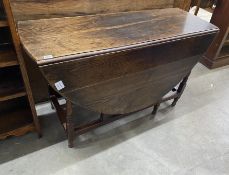 An early 18th century oak oval topped gate leg dining table, width 120cm, depth 45cm, height 71cm