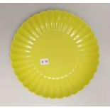 A Chinese yellow ground fluted dish, housed in a fitted case, 20cm in diameter