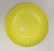 A Chinese yellow ground fluted dish, housed in a fitted case, 20cm in diameter