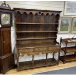 A late 18th /early 19th century oak pot board dresser with boarded rack (incorporating some new