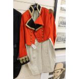 A 19th century red military jacket with gilt epaulettes, buttons and trim