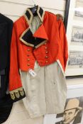 A 19th century red military jacket with gilt epaulettes, buttons and trim