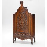 An 18th century French carved walnut miniature armoire/hutch with sliding front panel, 50cm high