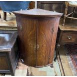 A George III mahogany bow front hanging corner cupboard, width 74cm, depth 47cm, height 105cm