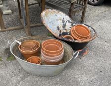 A vintage galvanised hip bath, height 54cm, an oval galvanised two handled grain trough and a