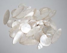 A collection of Chinese mother of pearl counters or tokens including two converted to drop earrings,
