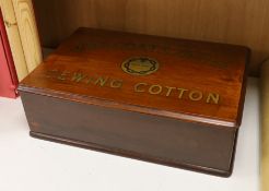 A retailer’s walnut counter box advertising 'J. & P. Coats Limited Sewing Cotton', two drawers