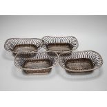 Four silver plated wire-work baskets, each 21cm wide