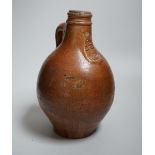A 17th century stoneware Bellarmine or Bartmann jug, 23.5cm