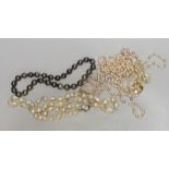 A quantity of blister and freshwater pearl necklaces, including a triple strand with yellow metal