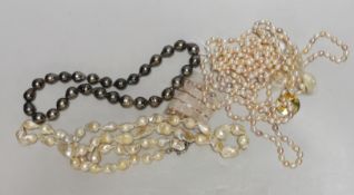 A quantity of blister and freshwater pearl necklaces, including a triple strand with yellow metal