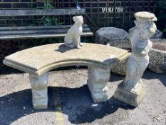 A small reconstituted stone curved garden bench, width 110cm, height 44cm, together with a stone