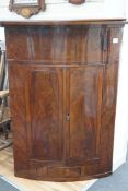 A Victorian mahogany bowfront hanging corner cupboard, width 93cm, depth 49cm, height 126cm