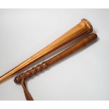 A copper hunting horn by Kohler & Son, a.f., in leather case and a turned wood truncheon, the