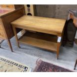 A mid century teak two tier table with hinged swivel top, width 83cm, depth 52cm, height 57cm