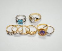 Eight assorted 18ct or 18k and gem set rings, including diamond and simulated diamond set, gross