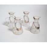 A set of four George VI silver mounted cut glass whisky noggins by Hukin & Heath, Birmingham,