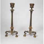 A pair of early 19th century brass candlesticks, 26cm