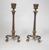 A pair of early 19th century brass candlesticks, 26cm