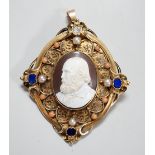 A Victorian yellow metal, lapis lazuli, split pearl, split coral and diamond set oval cameo shell