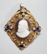 A Victorian yellow metal, lapis lazuli, split pearl, split coral and diamond set oval cameo shell