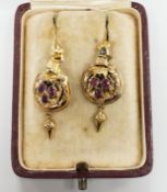 A pair of 19th century yellow metal and three stone garnet set drop earrings, overall 40mm, gross