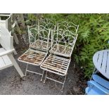 Four painted metal folding garden chairs