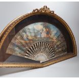 A 19th century French bone fan with pierced decoration, hand painted with figures wearing 18th