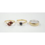 A modern 18ct gold, sapphire and diamond set cluster ring, size N/O, a similar 18ct gold, two