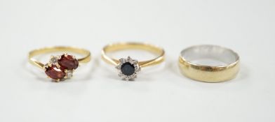 A modern 18ct gold, sapphire and diamond set cluster ring, size N/O, a similar 18ct gold, two